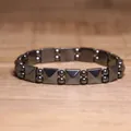 Detailed view of a dark grey hematite elastic bracelet with geometric beads. - Pyramid Square Alternate Style (#20)