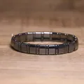 Detailed close-up showing the metallic sheen of a dark grey hematite stretch bracelet - Smooth Polished Rectangle Style (#21)
