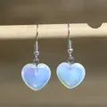 Close-up detail of translucent heart-shaped stone dangles on minimalist silver hooks - Heart Style 7 (Light Blue Stone)