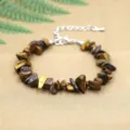 Natural Tiger Eye irregular chip stone bracelet featuring a silver lobster clasp and chain - Tiger's Eye