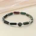 Detailed view of a handmade dark green stone bead bracelet with elegant silver spacers - India Agate