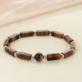 Macro view of a natural tiger eye stone bracelet with rectangular and round beads - Tiger Eye Stone Bracelet