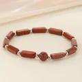 Healing brown goldstone energy bracelet featuring rectangle beads and shiny silver accents - Goldstone