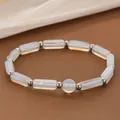 Elegant white translucent opalite crystal bead energy bracelet with silver metal spacers - Opal