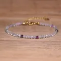 Close-up detail of colorful faceted natural tourmaline beads on a delicate bracelet - Purple Faceted Style (#1)