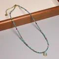 Handgemaakte gekleurde kralenketting met turquoise hart hanger en gouden afwerking. - Hart Turkoois Hanger Stijl (XL0149)