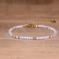 Detailed macro view of a handmade beaded bracelet with opalite beads and gold accents - Translucent Opal White Gold Style (#4)