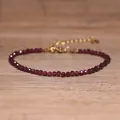 Detailed view of faceted red natural stone bead bracelet with elegant gold extender chain - Deep Red Garnet Style (#8)