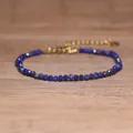 Macro detail of handmade faceted blue lapis lazuli stone beads with a gold extender chain - Dark Blue Lapis Style (#5)
