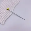 Elegant white ballpoint pen with gold heart top ornament, sleek metal design for gifts. - Gold Accessories / White