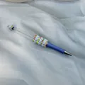 Blue DIY beadable ballpoint pen featuring pastel heart beads and sparkly rhinestones - Haze Blue