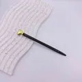 Elegant black metal ballpoint pen featuring a golden heart top for business gift use - Gold Accessories / Black