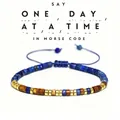 Verstelbare Morse-code armband met natuurlijke lapis lazuli en tijgeroog kralen. - One Day At A Time (Lapis Lazuli)