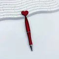 Elegant red twist ballpoint pen with heart-shaped top, ideal for Valentine's Day gifts. - 1.0mm Bullet Tip / Red