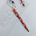 Festive red metal ballpoint pen with gingerbread man pattern and rose gold accents - Gingerbread Man / Red