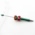 Festive DIY Christmas beaded ballpoint pen with glitter green body and cute holiday charms - Teal