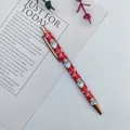 Festive red ballpoint pen with Santa Claus pattern and rose gold accents for Christmas. - Santa Claus / Red