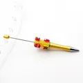 Gold DIY Christmas beaded ballpoint pen featuring festive charms and sugar beads - Yellow