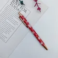 Red metal Christmas ballpoint pen with white snowflake patterns and rose gold trim - Snowflake Style / Red