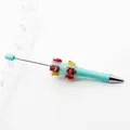 DIY Christmas theme beaded ballpoint pen featuring cute holiday beads and mint green barrel - Light Blue