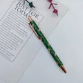 Green Christmas ballpoint pen with rose gold metal accents and Santa Claus pattern - Gingerbread Man / Green