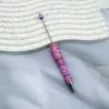 Handcrafted purple beaded ballpoint pen with pink cream glue decor and metal DIY rod - Light Lavender