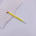 Charming yellow gradient metal ballpoint pen featuring a rose gold heart top design - Bright Yellow Gradient