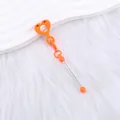 Charme en silicone cœur sourire orange vif pour porte-clés et pailles de boisson. - Orange