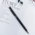 Elegant black metal ballpoint pen with silver clip on a minimalist white background - Black