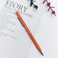 Elegant orange metal ballpoint pen featuring a polished silver clip and flat-top design - Hermes Orange