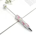 Bolígrafo luminoso creativo con motivos florales rosas y decoración completa de diamantes AB - Fénix Rosa