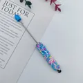 Multi-functional ballpoint pen with a vibrant candy sprinkle beaded grip and stylus tip. - 1.0mm Bullet Tip / Blue
