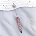 Sparkling ballpoint pen with pink pearls and shimmering rhinestones on a red base. - 1.0mm Bullet Tip / Red