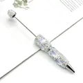 Bolígrafo de cuentas luminosas con diamantes AB y diseño de flores en relieve - Cisne Azul