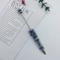 Handcrafted rhinestone beaded ballpoint pen with blue stars and rainbow mermaid beads - Black
