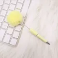 Cute yellow pom-pom ballpoint pen featuring soft faux fur on a white background texture - Milky Yellow