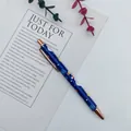 Festive blue Christmas ballpoint pen with rose gold accents and snowman print SKU - Snowman / Blue