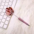 Cute purple ballpoint pen with leopard print pom pom atop a soft white fur background - Pink Black Ball