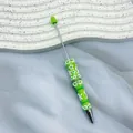 Creative green ballpoint pen featuring handcrafted cream glue floral relief design - Macaron Green