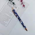 Elegant blue Christmas ballpoint pen featuring Santa Claus print and rose gold metal accents - Christmas Mixed Styles / Blue