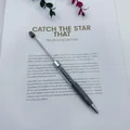 Grey DIY beadable ballpoint pen filled with dark crystal stones on a white background - Gray
