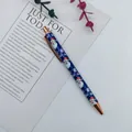 Rose gold metal retractable ballpoint pen with festive blue Santa Claus holiday patterns - Santa Claus / Blue