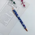 Retractable blue ballpoint pen with festive white snowflake pattern and rose gold trim - Snowflake Style / Blue