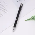 Elegant black metal ballpoint pen with silver accents on a minimalist white desk setup - Black
