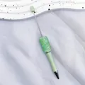 Mint green DIY beaded ballpoint pen featuring sparkling resin crystals and metal stem - Pine Green
