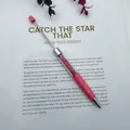 Elegant pink beadable ballpoint pen filled with sparkling pink crystal stones background - Barbie Pink