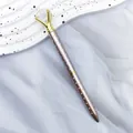 Elegant rose gold ballpoint pen with white polka dots and large crystal diamond top - Rose Gold
