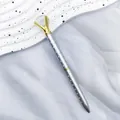 Silver polka dot ballpoint pen with a large crystal diamond top and gold claw setting - Silver