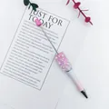 Decorative beaded ballpoint pen with pink pearls and crystals on white background. - Rose Red White Pink