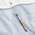 Gold ballpoint pen with star-shaped candy bead accents and telescopic metal rod - 1.0mm Bullet Tip / Gold